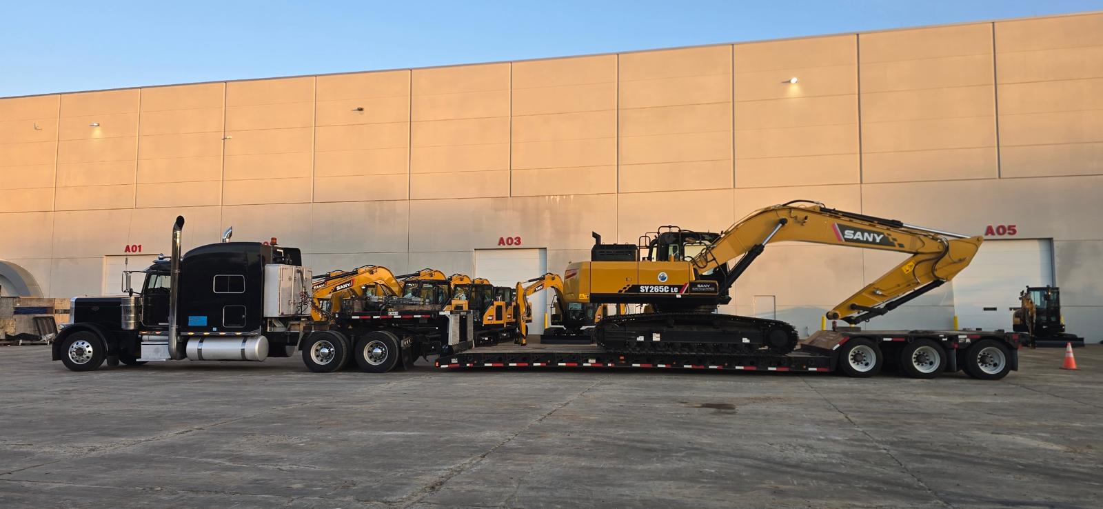 RGN removable gooseneck trailer hauling heavy excavators